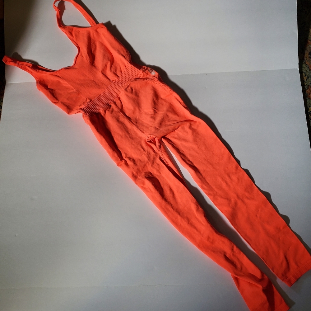 NWOT Free people movement good karma onesie